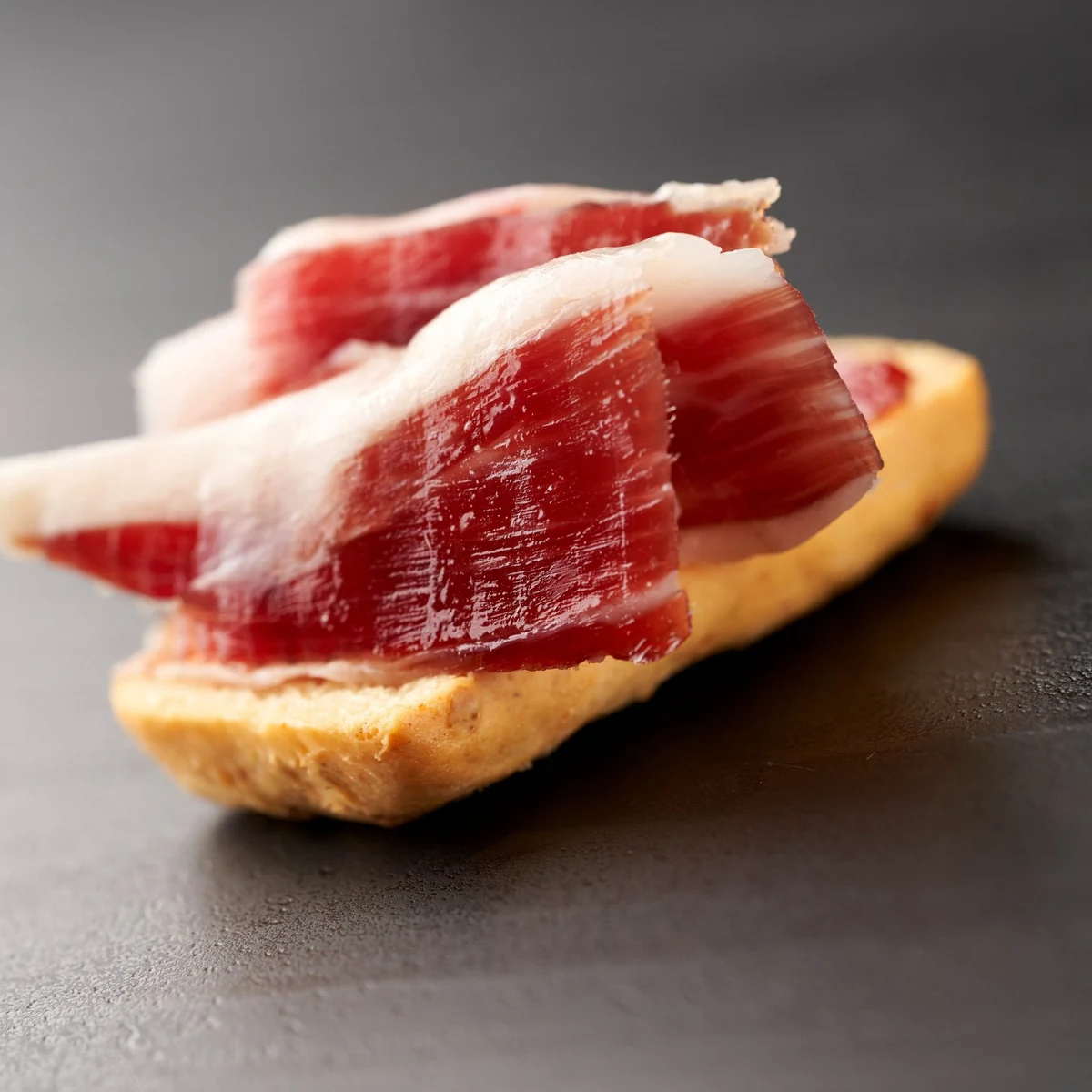 100% Iberian Pata Negra Oro VNC Acorn-Fed Ham, hand-sliced with a knife